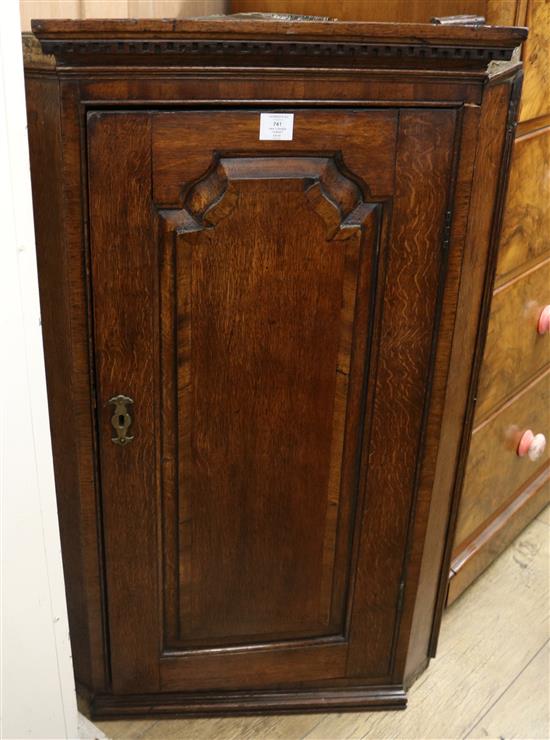 A George III oak corner cabinet W.67cm (a.f.)